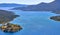 View of harbor between Spinalonga island and peninsula, known as Kalydon, and Plaka village from above, Crete, Greece.