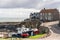 A view of the harbour area in Craster, Northumberland, UK, with fishing boats