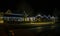 A view of the harbour entrance at night in Saundersfoot village in Wales