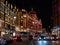 View of the Harrods Department Store on Brompton Road in Knightsbridge, London at night.