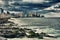 View of Havana malecon and skyline with dramatic storm clouds