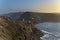 View of the headlands at the entrance of the SÃ£o Martinho do Porto bay, with the lighthouse