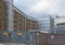 A view of a heavily protected fenced off area with steel gates behind the offices and apartments of the leeds dock area