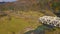 View from the height on the autumn mountain landscape - yellow forest, river, railway bridge and and vehicle passing