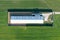 View from a height of a large livestock farm. Outbuildings, big houses in the field