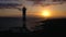 View from the height of the lighthouse silhouette Faro de Rasca at sunset on Tenerife, Canary Islands, Spain. Wild Coast