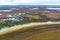 The view from the helicopter to the autumn northern tundra with the first snow.