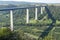 View on high freeway viaduct bridge across Mosel river valley and terraced vineyards, road network and transportation is Germany