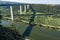 View on high freeway viaduct bridge across Mosel river valley and terraced vineyards, road network and transportation is Germany