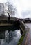 View of high rise blocks of flats in Birmingham City Centre, reflected in the water of the canal on a cold winter`s day.