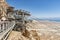 View from a high view of the landscape around the Dead Sea, the parking place in the desert and the starting station of the cable