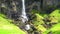 View of high waterfall in sunny day