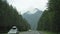 View of the highlands through the windshield during the car drive on a overcast spring morning. Picturesque country