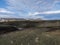 View on hiking path Laugavegur trail at Rhyolit Landmannalaugar mountain with snow fiields and multicolored volcanos at