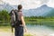 View on hiking tourist and lake near Alps in Almsee in Austria