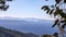 View from a hill on the blue ridges of mountains and the blue sea