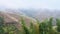 view of hills with terraced rice fields over haze