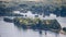 view on hillside vineyards along the Rhine River and the fulder aue island in the rhine near ruedesheim