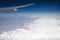 View of the Himalayas mountain range from airplane window. Airplane wing