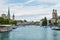 View of the historic buildings and bridge of Zurich at the bank of Limmat River and Zurich lake, with landmark of FraumÃ¼nster