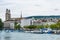 View of the historic buildings and bridge of Zurich at the bank of Limmat River and Zurich lake, with landmark of Zurich