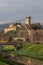 View of the historic center of Vicopisano, Italy, with fog over the surrounding mountains