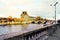 The view of a historic palace and one of the bridges over the Seine in Paris in the autumn