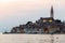 View of the historic part of Rovinj in Croatia during sunset. Above the town rises the Church of St. Euphemia.