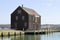 View of historic pier and timber sail loft building in Salem