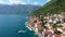 View of the historic town of Perast at famous Bay of Kotor on a beautiful sunny day with blue sky and clouds in summer, Montenegro