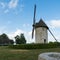 View of the historic windmill Moulin de Pierre and old millstones in Hauville in Normandy