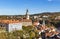 View of historical center of Cesky Krumlov town on Vltava riverbank on autumn day, Czechia