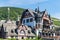 View on an historical German frame house with hill and vineyards in the background