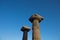 View of historical ruins with clear, blue sky background captured in the temple of Athena at the ancient city of Assos