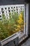 View through the hole for a balcony in a damaged abandoned panel house