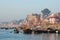 A view of holy ghats of Varanasi with a boatman sailing