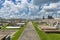 View of the Holy Rosary Cemetery in Taft, Louisiana, with a petrochemical plant on the background.