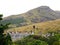 View of Holyrood House, Edinburgh with green hills beyond, Scotland