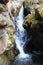 View of honey waterfall in river gorge Alikonovka