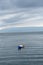 view of the horizon of lake toba in the morning with cloudy weather with a fisherman in the middle of the lake