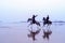 View of horses and riders on the beach, Essaouira