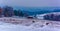 View of horses and snow covered farm fields in rural York County