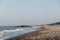 View of Horsey Gap beach, Norfolk, UK, selective focus, unidentifiable people on horizon