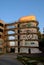 View of the hospital building and concrete structure for evacuation in case of fire in the rays of the rising sun.