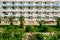 View from hotel balcony in Tunisia, the resort of Sousse, arab garden on sea. Middle Eastern cityscape with palm trees and