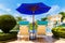 View from a hotel with sun loungers and a parasol in front of the infinity pool on the tropical island of Boracay, Philippines.