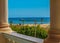 The view from the hotel window to the red sea, the beach and the marina under the blue sky