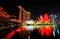 View of the hotel Â«Marina Bay SandsÂ», Art Science Museum, Helix Bridge and Marina Bay Financial Centre in the evening.