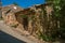 View of house in alley with sunny blue sky in Sillans-la-Cascade