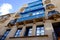 View on a house with blue balconies in Valletta, Malta